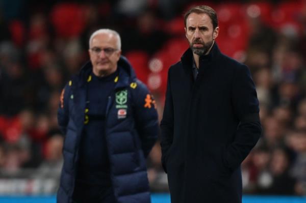 England’s manager Gareth Southgate (right) and Brazil’s head coach Dorival Junior (left) look on during the internatio<em></em>nal friendly football match between England and Brazil at Wembley stadium in north Lo<em></em>ndon on March 23, 2024. — AFP pic