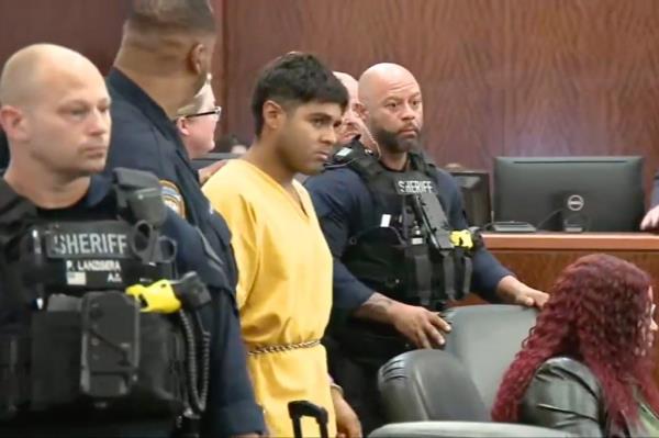 Johan Jose Rangel Martinez, 21, appears in court accompanied by several sheriffs deputies.