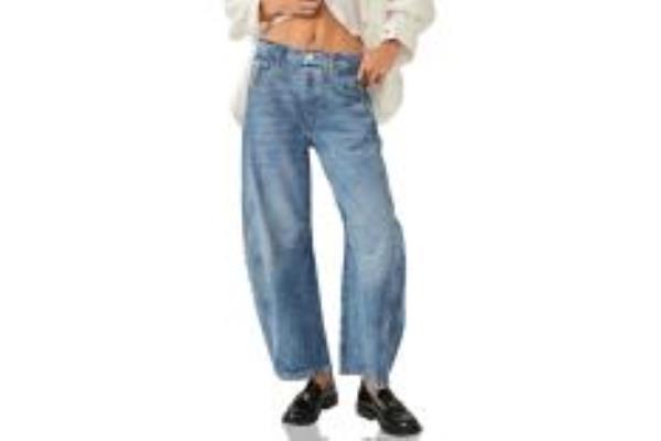 A woman in blue baggy jeans.