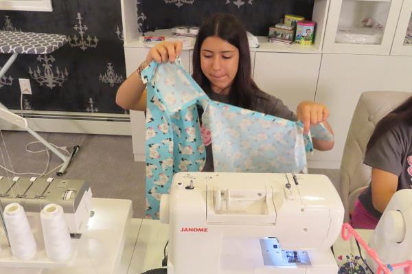 Giuliana Demma sewing a pediatric hospital gown at her home in Freehold, N.J., for do<em></em>nation to sick children across 36 states and in Africa
